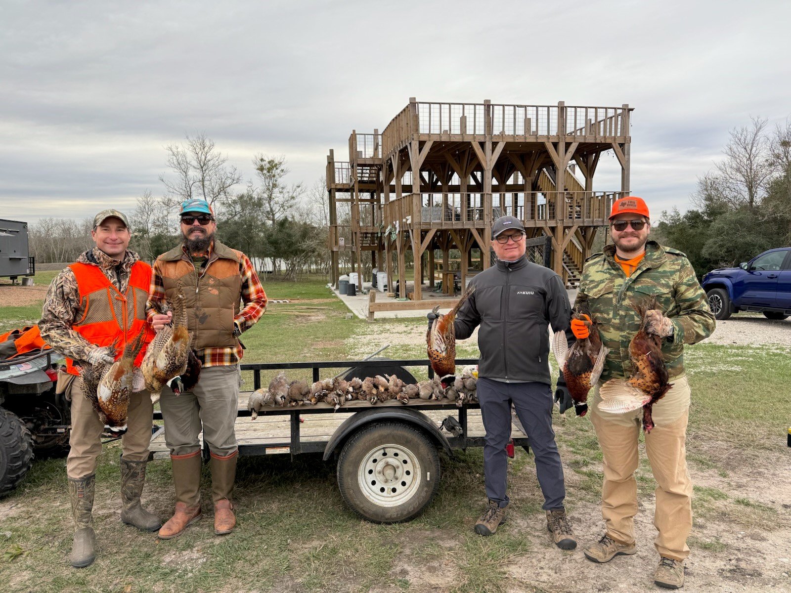 Hunters with pheasants