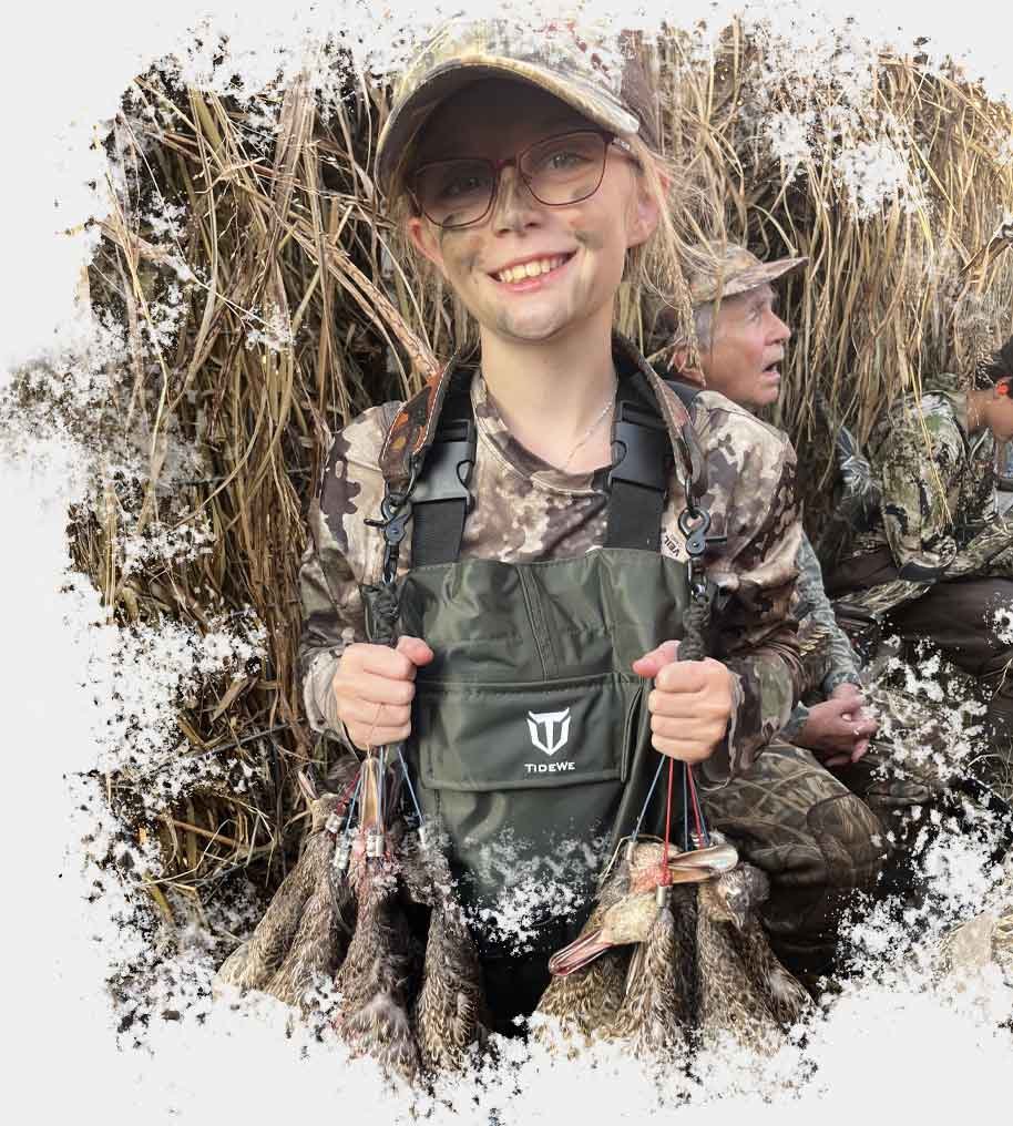 smiling girl with ducks after a hunt